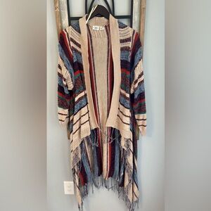 Cato Sweater with fringe. Cream with multiple color strips.